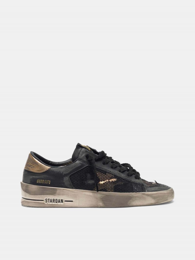Distressed black and gold Stardan LTD sneakers