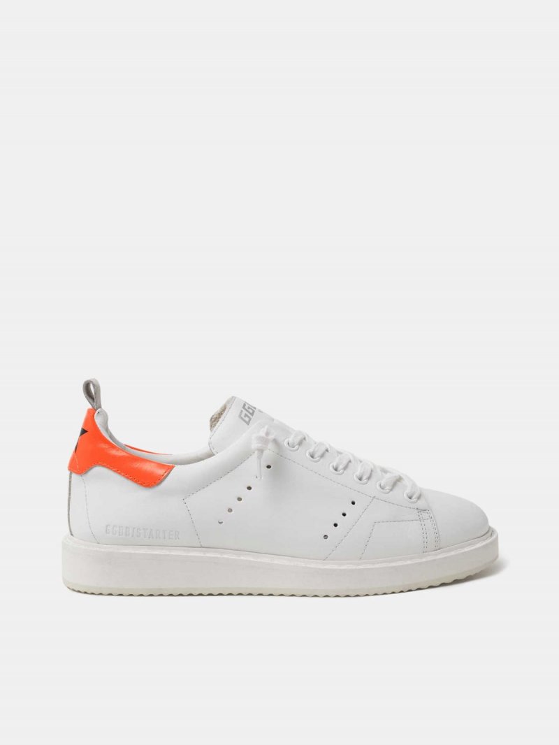 White Starter sneakers with fluorescent orange heel tab