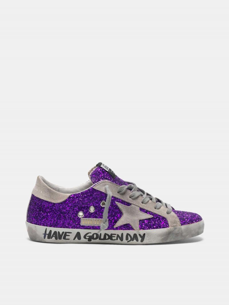 Super-Star sneakers with purple glitter and lettering on the foxing
